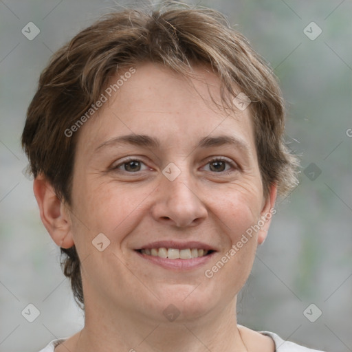 Joyful white adult female with short  brown hair and grey eyes