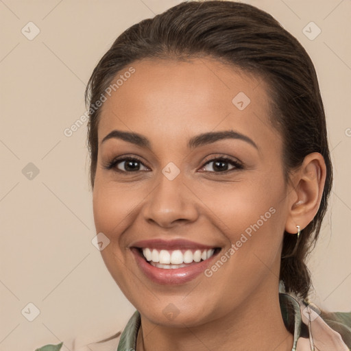 Joyful white young-adult female with long  brown hair and brown eyes