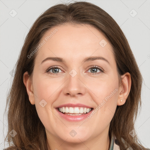 Joyful white adult female with medium  brown hair and grey eyes