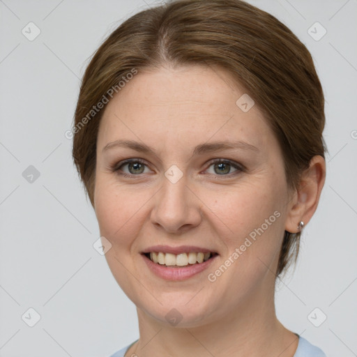 Joyful white young-adult female with medium  brown hair and grey eyes