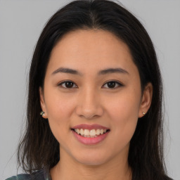 Joyful asian young-adult female with medium  brown hair and brown eyes