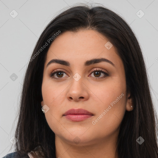 Joyful latino young-adult female with long  brown hair and brown eyes