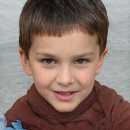 Joyful white child male with short  brown hair and brown eyes