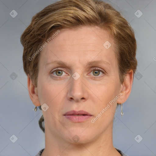 Joyful white adult female with short  brown hair and grey eyes