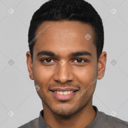 Joyful black young-adult male with short  black hair and brown eyes