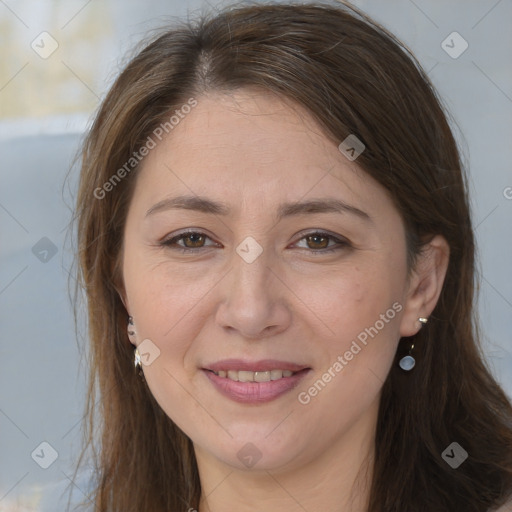 Joyful white adult female with long  brown hair and brown eyes