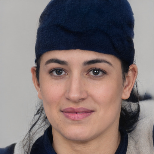 Joyful white young-adult female with short  black hair and brown eyes