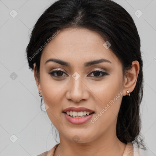 Joyful latino young-adult female with medium  brown hair and brown eyes