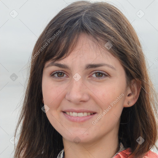 Joyful white young-adult female with long  brown hair and grey eyes