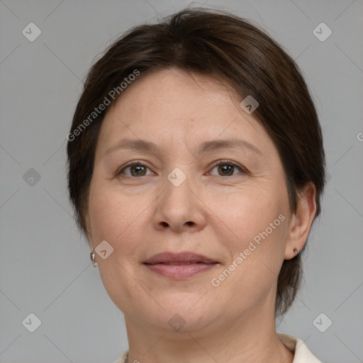 Joyful white adult female with medium  brown hair and brown eyes