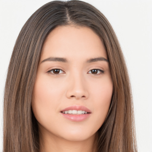 Joyful asian young-adult female with long  brown hair and brown eyes