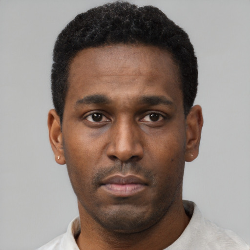 Neutral black young-adult male with short  black hair and brown eyes