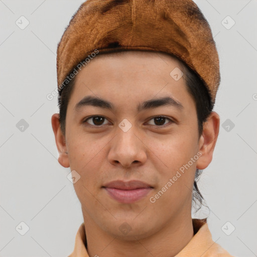 Joyful asian young-adult male with short  brown hair and brown eyes