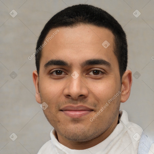 Joyful latino young-adult male with short  brown hair and brown eyes