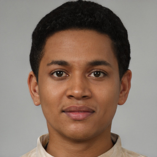 Joyful latino young-adult male with short  brown hair and brown eyes