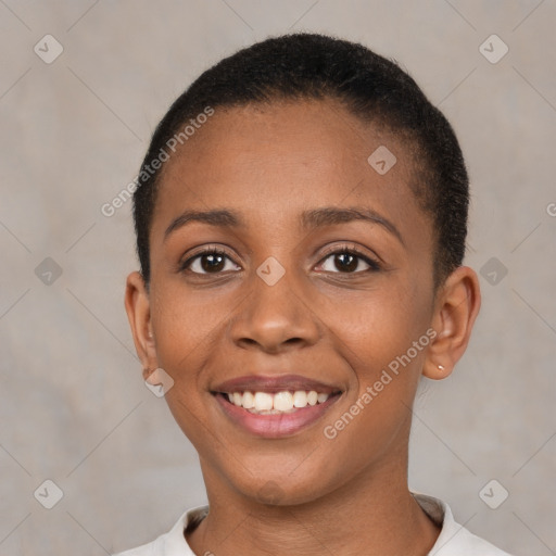 Joyful black young-adult female with short  brown hair and brown eyes