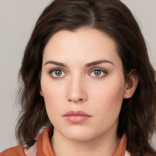 Neutral white young-adult female with medium  brown hair and brown eyes