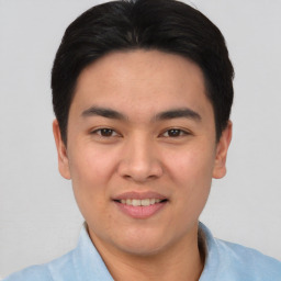 Joyful asian young-adult male with short  black hair and brown eyes