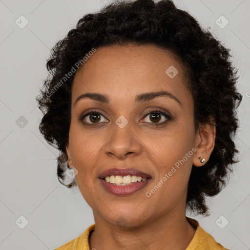 Joyful black young-adult female with medium  brown hair and brown eyes