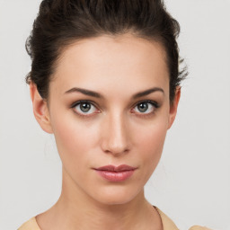 Neutral white young-adult female with short  brown hair and brown eyes