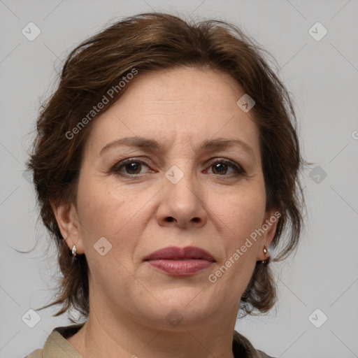 Joyful white adult female with medium  brown hair and grey eyes