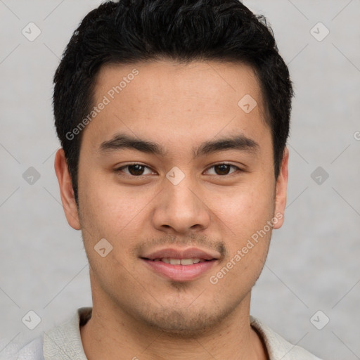 Joyful latino young-adult male with short  brown hair and brown eyes