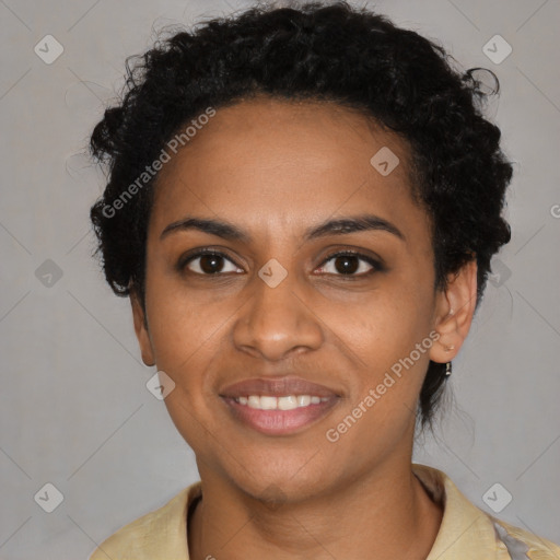 Joyful black young-adult female with short  black hair and brown eyes