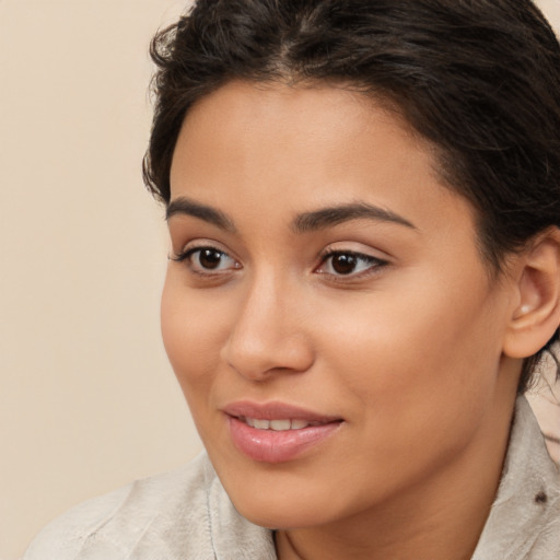 Joyful white young-adult female with long  brown hair and brown eyes