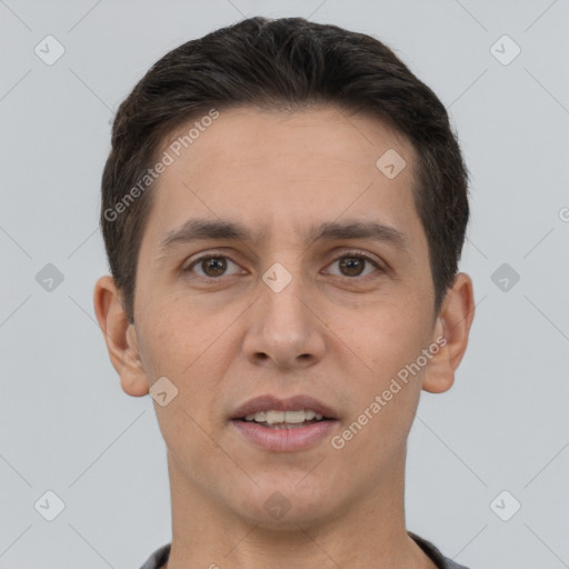 Joyful white young-adult male with short  brown hair and brown eyes