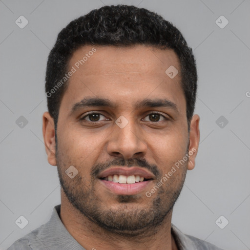 Joyful latino young-adult male with short  brown hair and brown eyes