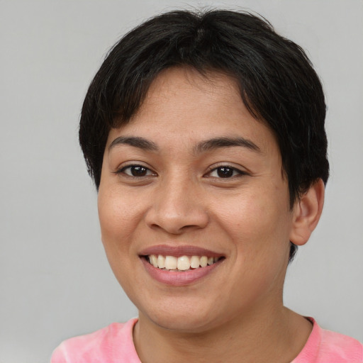 Joyful asian young-adult female with short  brown hair and brown eyes