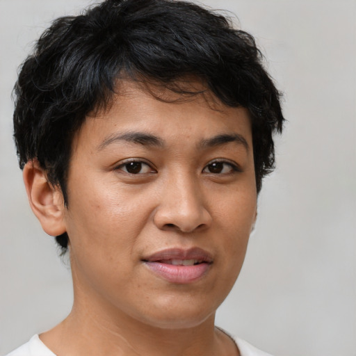 Joyful latino young-adult female with short  brown hair and brown eyes