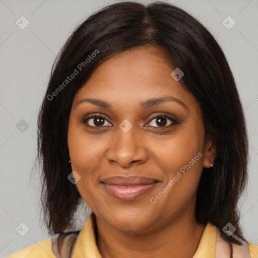 Joyful black young-adult female with medium  brown hair and brown eyes