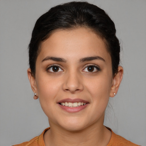 Joyful white young-adult female with short  brown hair and brown eyes