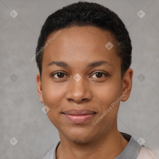 Joyful black young-adult female with short  black hair and brown eyes