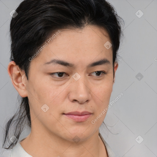 Joyful asian young-adult female with medium  brown hair and brown eyes