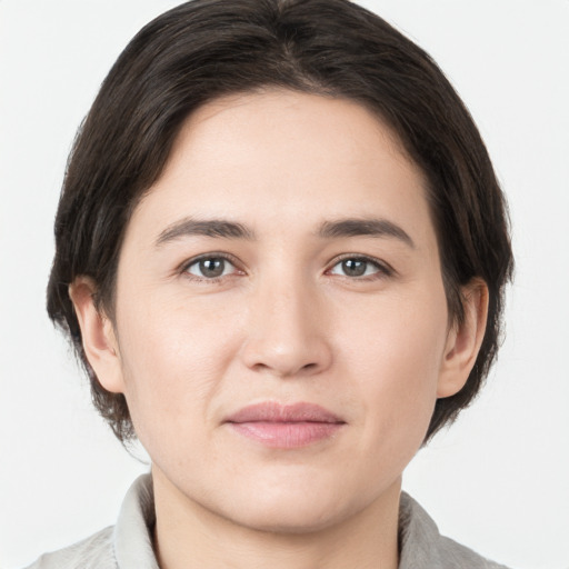 Joyful white young-adult male with medium  brown hair and brown eyes