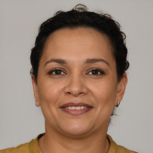 Joyful white adult female with short  brown hair and brown eyes