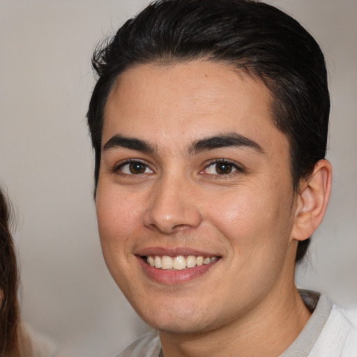 Joyful white young-adult male with medium  brown hair and brown eyes