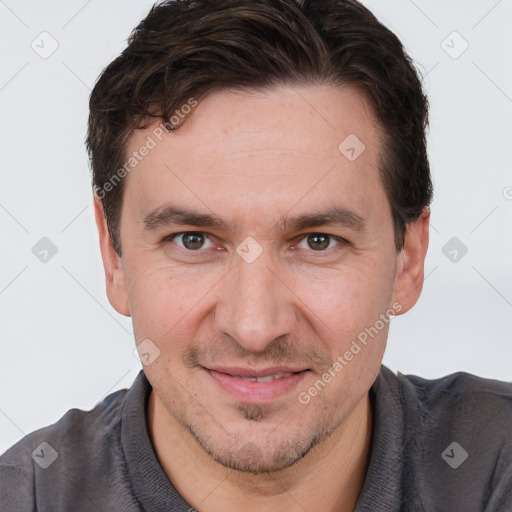 Joyful white adult male with short  brown hair and brown eyes