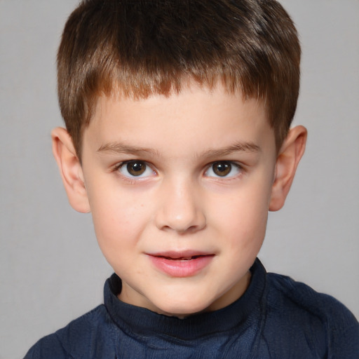 Joyful white child male with short  brown hair and brown eyes