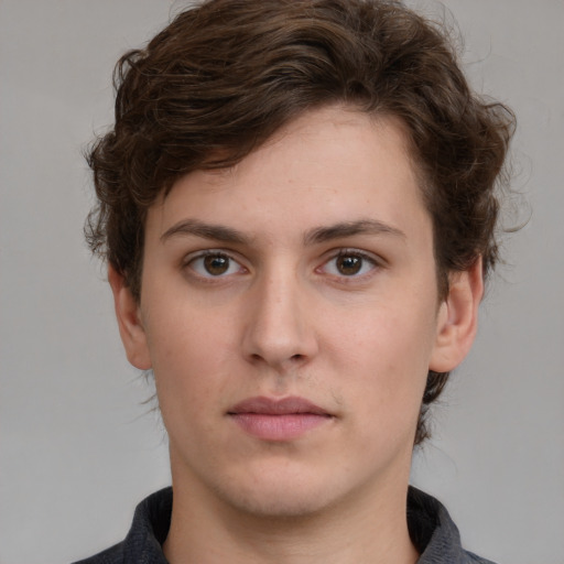 Neutral white young-adult male with medium  brown hair and brown eyes