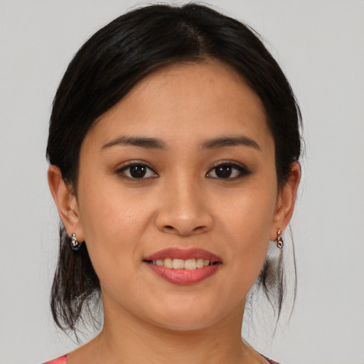 Joyful asian young-adult female with medium  brown hair and brown eyes