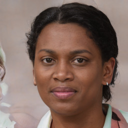 Joyful black young-adult female with medium  brown hair and brown eyes