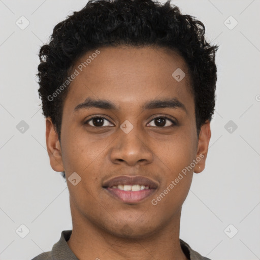 Joyful black young-adult male with short  brown hair and brown eyes