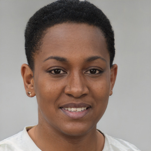 Joyful black young-adult female with short  brown hair and brown eyes