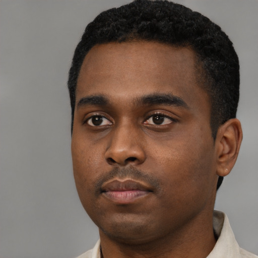 Neutral black young-adult male with short  black hair and brown eyes