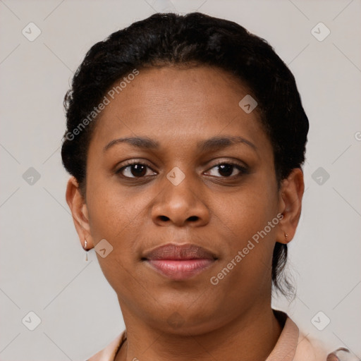 Joyful black young-adult female with short  brown hair and brown eyes