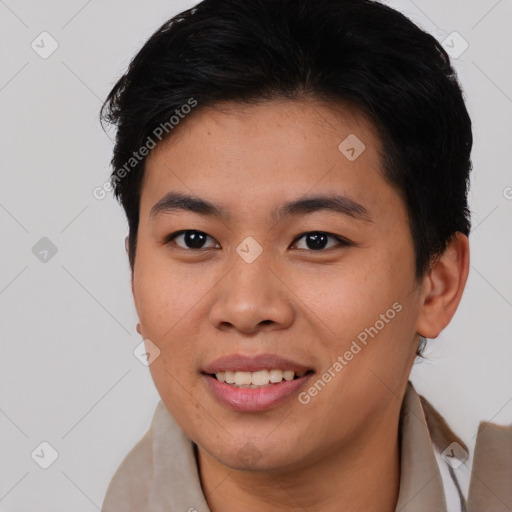 Joyful asian young-adult male with short  brown hair and brown eyes