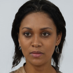 Neutral black young-adult female with medium  black hair and brown eyes